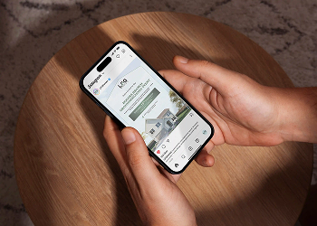 Mobile app shown on a phone held in two hands