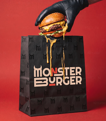 Monster Burger branded takeaway bag with a burger