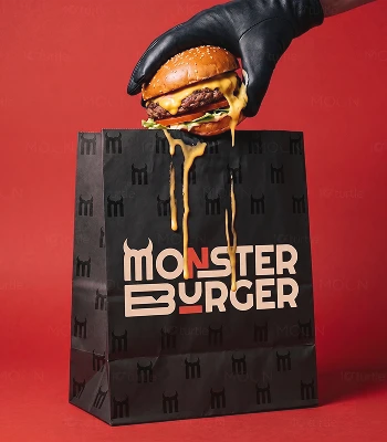 Monster Burger branded takeaway bag with a burger